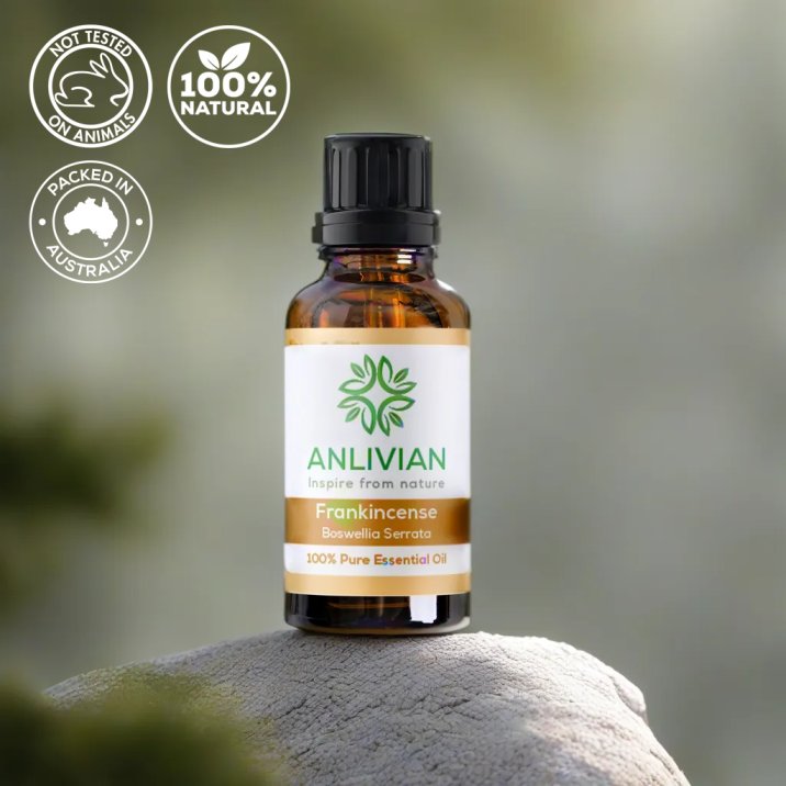 Anlivian frankincense essential oil bottle on a rock with nature background