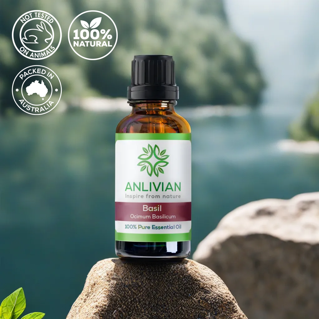 Anlivian Basil Essential Oil bottle on a rock with a blurred background of cliffs and water. Icons confirm the product is Not Tested on Animals, 100% Natural, and Packed in Australia.